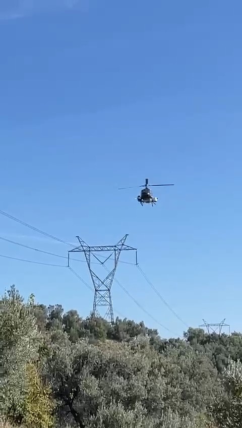 Yüksek gerilim hatları helikopterle temizlendi